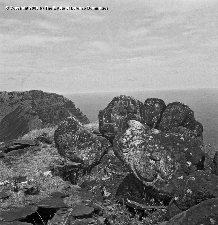 ORO_031.jpg - Easter Island. 1960. Orongo. Rocks on the cliffs with petroglyphs representing birdmen.